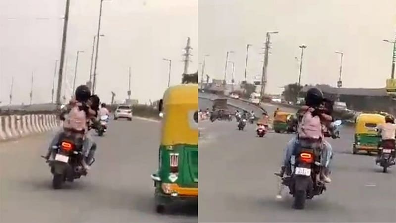 दिल्ली में बाइक पर रोमांस करता जोड़ा
