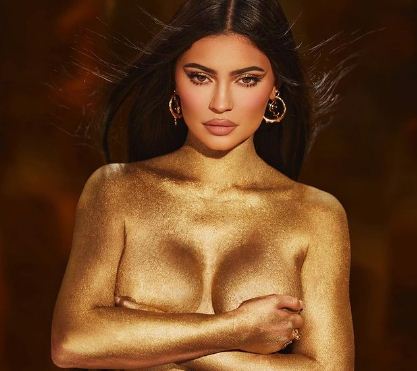 Kylie Jenner stuns in gold dust body paint photo