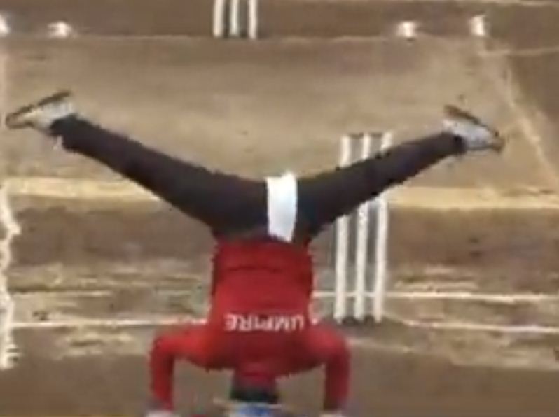 This umpire does the umpire by standing on his head and not on his feet, this umpire is going viral on social media