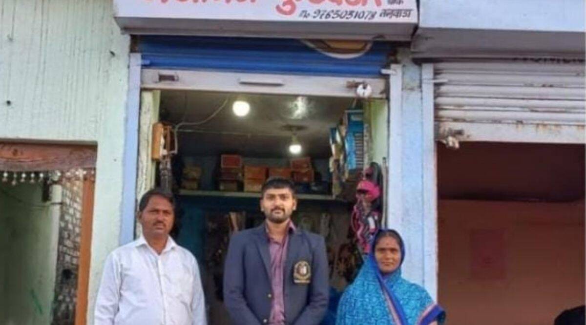 Shooter Gajanan Shahadev Khandagale with his parents in front of the family footwear store at Talwada village Beed