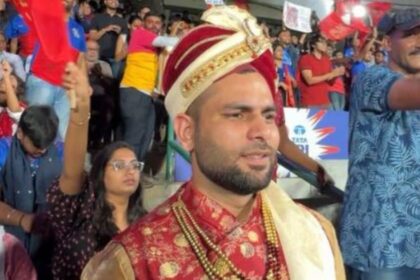 A turban on his head and a string of pearls around his neck...the boy came to watch the match dressed as a groom.