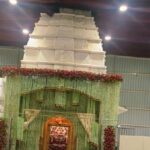 In India, the idol of which temple is decorated not with clothes but with flowers?