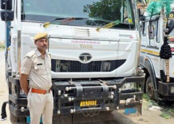 A loader and a dumper filled with gravel seized
