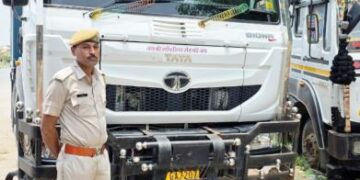 A loader and a dumper filled with gravel seized