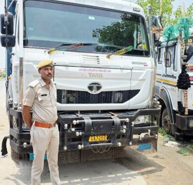 A loader and a dumper filled with gravel seized