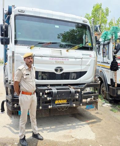 A loader and a dumper filled with gravel seized
