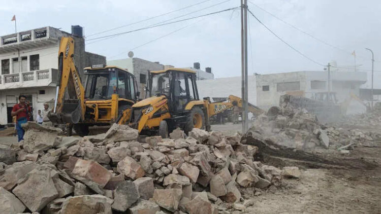 Bulldozer went on the cemetery in Bharatpur, broke the wall and removed