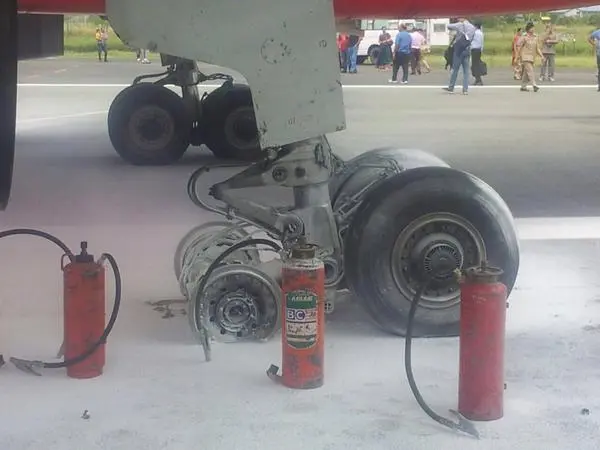 A major accident with AirIndia flight, all three tires torn with landing, airport runway closed.