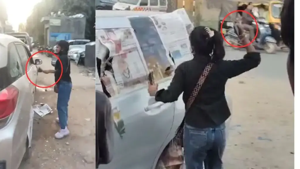 Wife angry with her husband created a ruckus on the road, broke all the glass of the car one by one, VIDEO goes viral