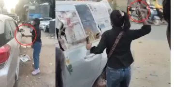 Wife angry with her husband created a ruckus on the road, broke all the glass of the car one by one, VIDEO goes viral