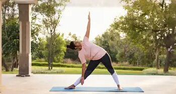 Trikonasana strengthens digestion along with relieving stress, beneficial for those who work sitting for long hours.