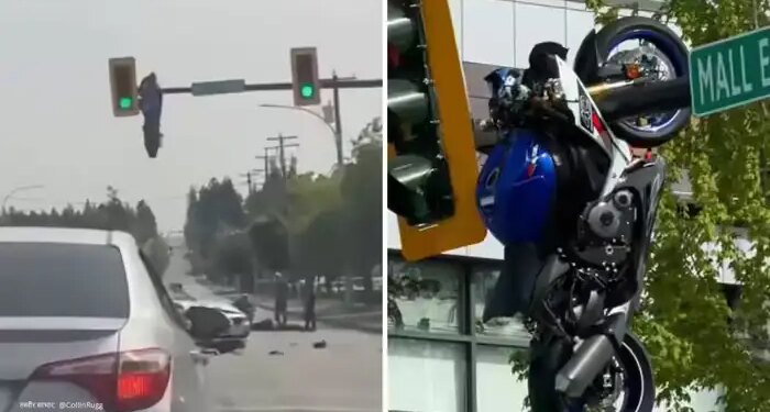 Road accident in Canada: Due to collision with car, bike bounces and hangs on traffic signal pole, video goes viral
