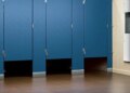 Why is there a gap below the toilet doors of cinema halls and shopping malls?