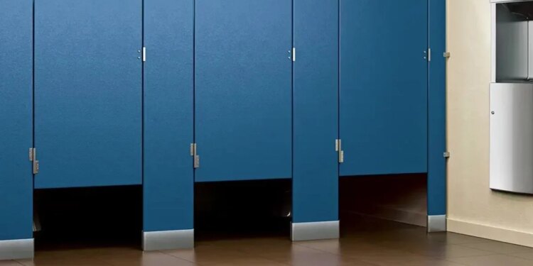 Why is there a gap below the toilet doors of cinema halls and shopping malls?